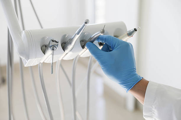 Professional Tooth Extraction technician working in Lake City, AR